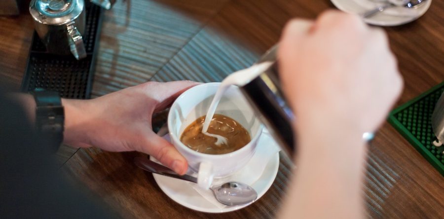 crop-barista-making-nice-latte-1000x600